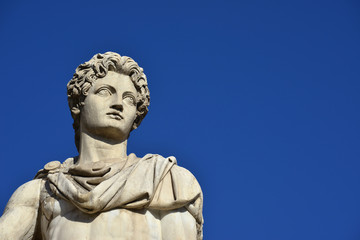 Fototapeta na wymiar Castor or Pollux with copy space. Ancient marble statue of Dioskouri at the top of monumental balustrade in Capitoline Hill, Rome