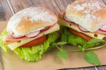 Ham cheese sandwiches with vegetables.