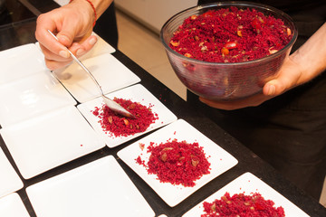 chief cook put cous cous on plate