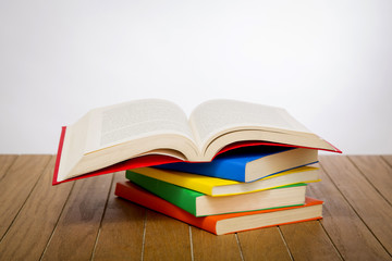 colorful books on wooden table