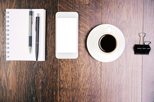 Cellphone, coffee and stationery