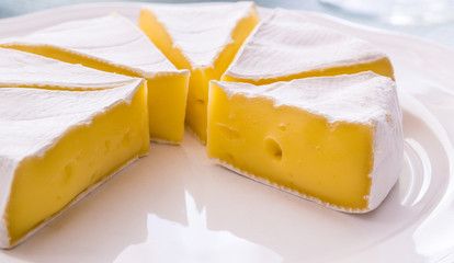 Yellow cheese on a plate