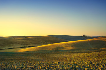 Fototapeta na wymiar Tuscany spring, rolling hills on sunset. Rural landscape. Green