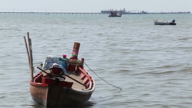 empty fishing boat floating on sea