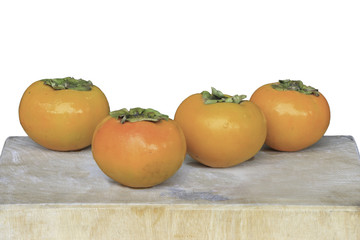 persimmon on wooden cutting boards isolate on white background