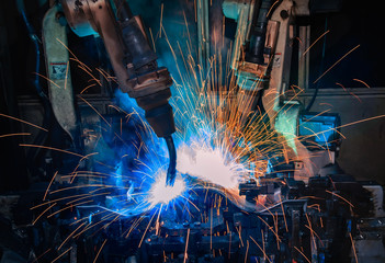 Fototapeta na wymiar Robots welding in factory
