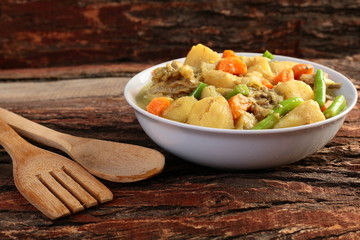 Potato and beef curry in sauce,