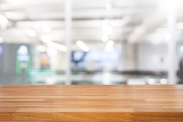 Empty wooden table and modern library background