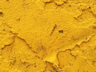 yellow painted concrete wall, grunge texture background