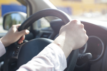 Close-up Of female Hand Holding Steering Wheel