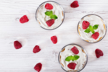 homemade yogurt in cups with whole grain flakes