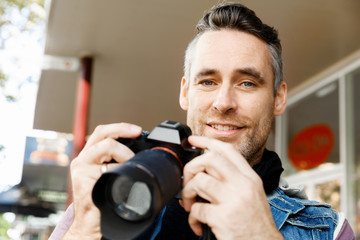 Male photographer taking picture