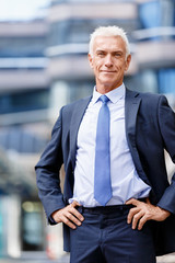 Portrait of confident businessman outdoors