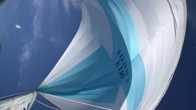 The wind blew up spinnaker at the bow of yacht
