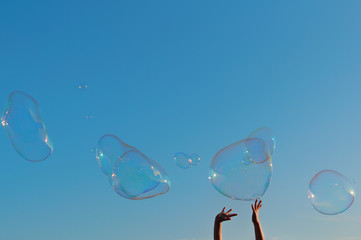 gigantic soap bubble toy with blue sky background