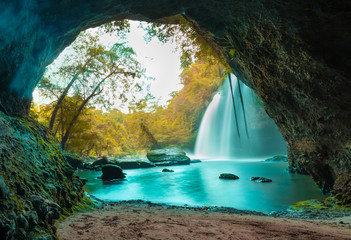 Amazing cave in autumn deep forest with beautiful waterfalls background at Haew Suwat Waterfall in Khao Yai National Park, Thailand