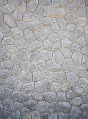 Pattern of grey and rough stone wall texture for background
