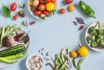Food background. Assortment of fresh vegetables on a blue background. Top view, free space for text