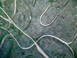 ground rolled roads on a field, aerial photo