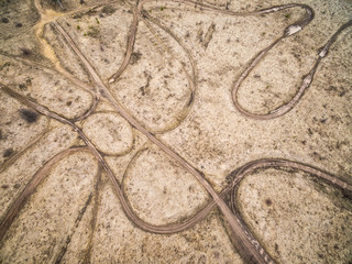 ground racing track wih trails from height, top view