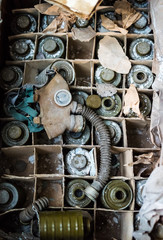 abandoned school room with masks in box on the floor in Pripyat, Chernobyl, Ukraine