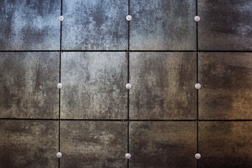 Modern metal plated building wall with rusty brown and blue colors