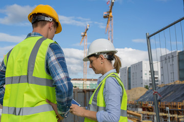 Female engineer and foreman working together