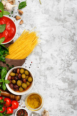 Raw Italian spaghetti with food ingredients