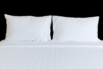 White bedding sheets and pillow isolated on black. Saved with cl