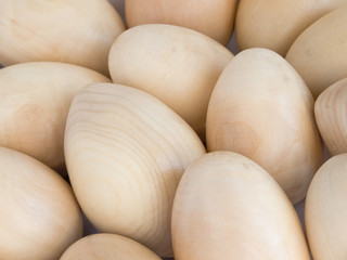 Background from wooden unpainted eggs