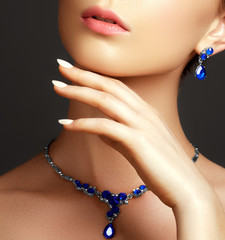 Elegant fashionable woman with jewelry. Beautiful woman with a sapphire necklace. Beauty young...