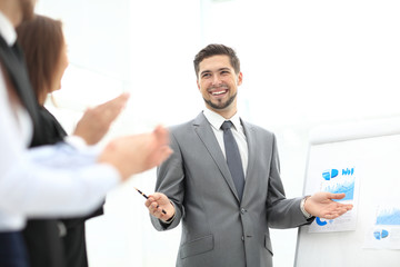 Successful business man at the office leading a group