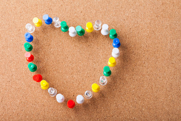 Group of Colored Pins arranged as Heart Shape