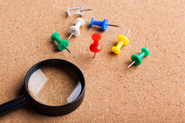 blank brown board and a magnifying glass