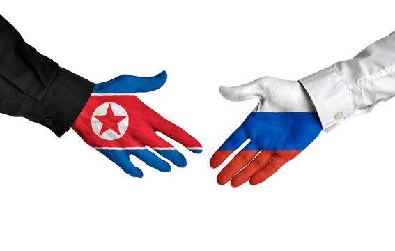North Korea and Russia leaders shaking hands on a deal agreement