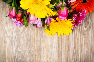 Obraz na płótnie Canvas Various flowers on wooden background