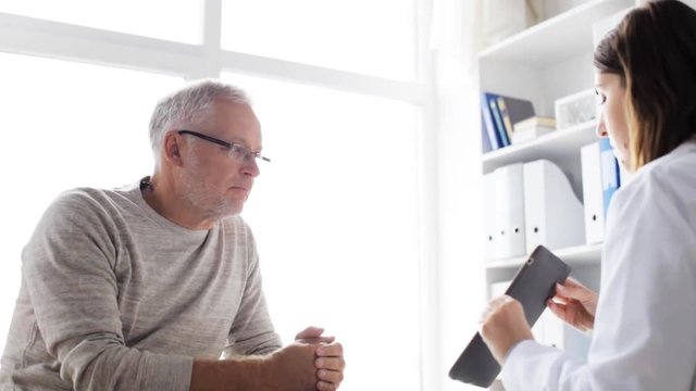 senior man and doctor with tablet pc at hospital 49