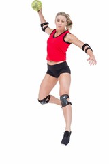 Female athlete with elbow pad throwing handball