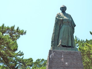 KOCHI, JAPAN - JULY 19, 2016:Statue of Sakamoto Ryoma stands on the hill near Katsurahama beach in Kochi, Japan. Sakamoto Ryoma is a prominent figure in Japan. He was born in Tosa (old name of Kochi).