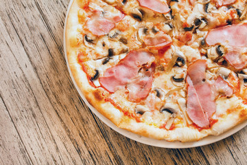 pizza on wooden background