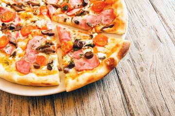pizza on wooden background