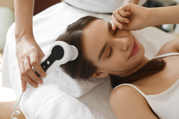 Hair Care. Woman Analyzing Hair With Analysis System. Beauty