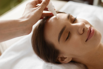 Obraz na płótnie Canvas Face Skin Care. Woman Receiving Serum Treatment In Beauty Salon