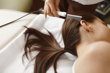 Fototapeta premium Brushing Beautiful Woman Long Hair. Hair Beauty Treatment