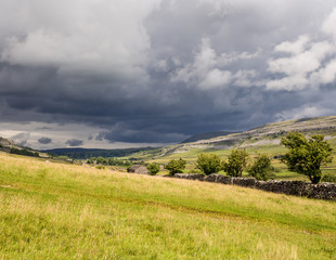 Fototapeta na wymiar Storm clouds approaching above the Ingleton Waterfalls Trail, Ingleton, North Yorkshire, UK