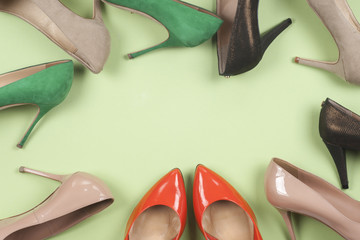 picture of different shoes, Shot of several types of shoes, Several designs of  women shoes. Leather Shoe. Pile of various female shoes on  light   background. Copy space for text.