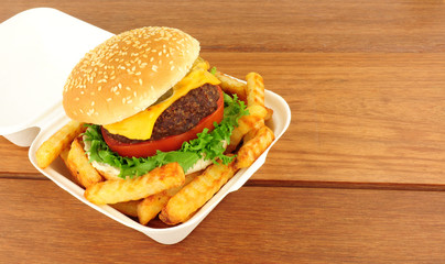 Cheese Burger And Fries In A Take Away Box