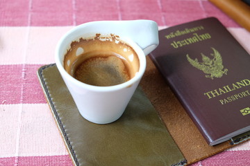 espresso coffee shot on the passport leather case.