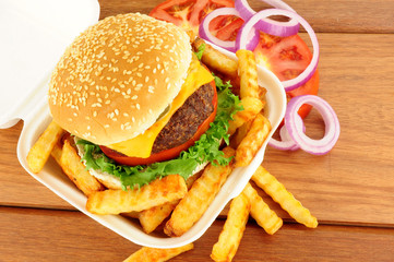 Cheese Burger And Fries In A Take Away Box