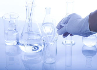 Test-tubes on a white and blue background.